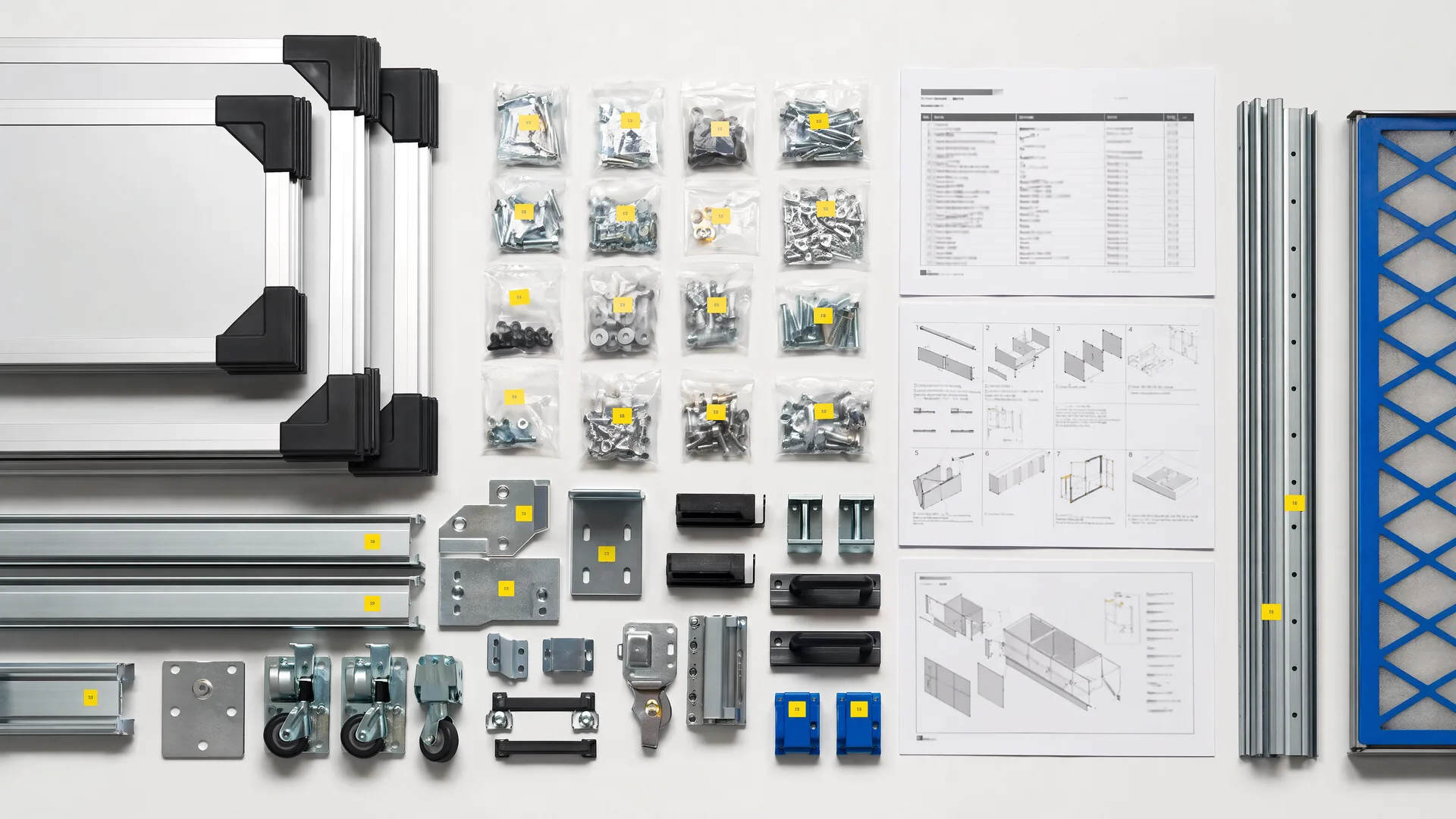 Representative modular kit hardware and assembly documentation arranged for handoff
